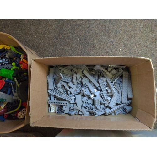 728 - Two plastic boxes with mixed size and style lego. 