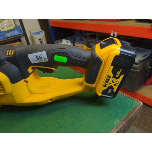 86 - DeWalt DCM563 battery hedge trimmer with 18v 5Ah battery, does not include charger. Appears in very ... 