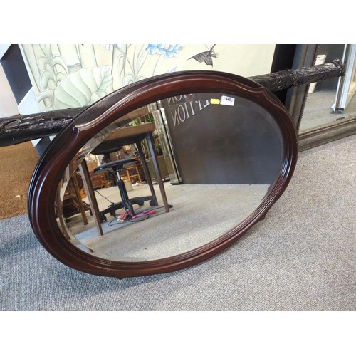 449 - Oval mahogany framed bevelled mirror 85 x 62cm