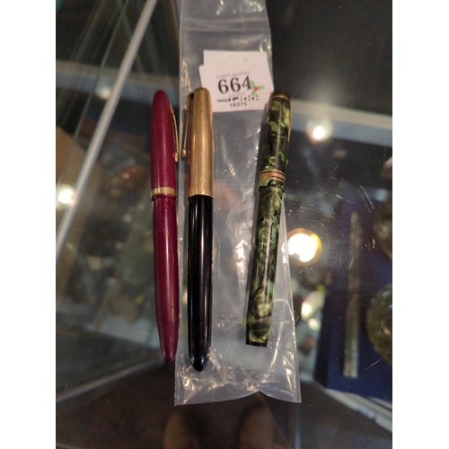 664 - Three fountain pens, including a Conway Stewart 388 green marble fountain pen with 14ct gold nib and... 