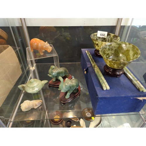 666 - Shelf of carved Jade, onyx plus other Eastern collectables in spinach jade bowls.