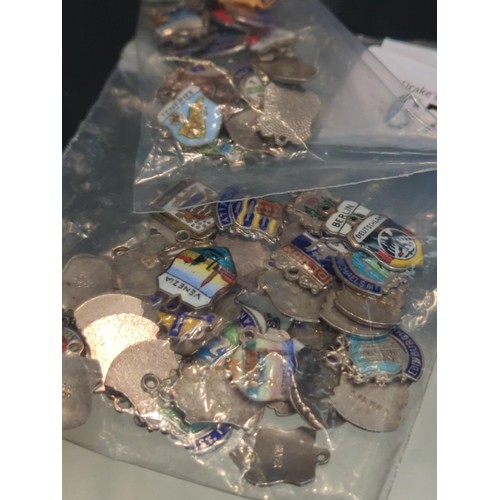 673 - Large collection of enamelled silver city/country charms, gross weight 87 grams