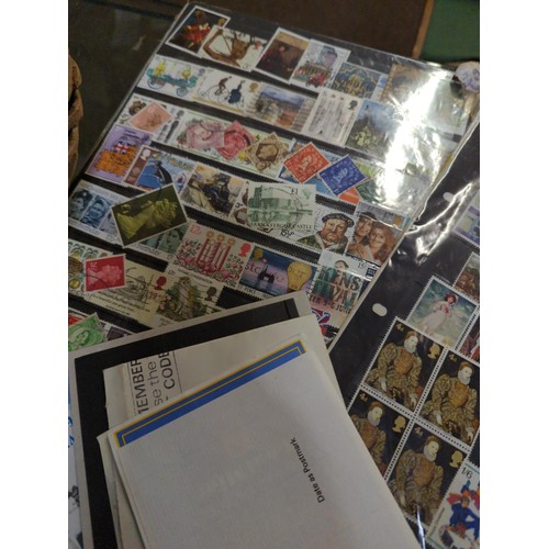 731 - Basket of loose world stamps and first day covers etc..,