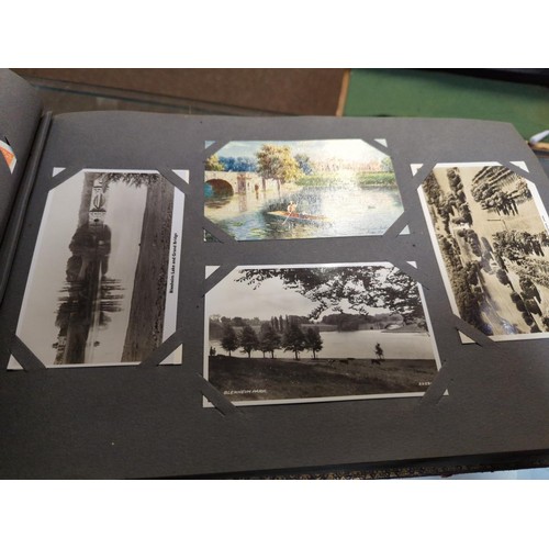 741 - Large part filled album of vintage art and topographical postcards