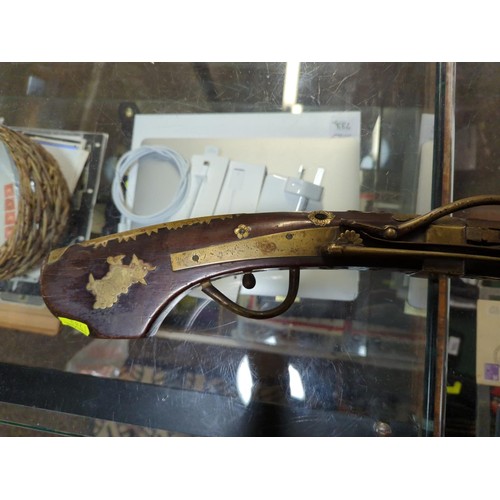 775 - Japanese matchlock rifle circa 1820 with inland brass scenes on barrel L. 135cm