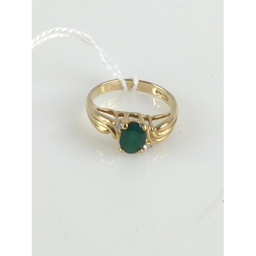 629 - 9ct gold ring set with synthetic emerald and CZ. Size P. Gross weight 3.90g