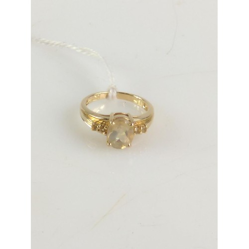 637 - 9ct gold paste ring with citrine accents. Size O. Gross weight 3.64g