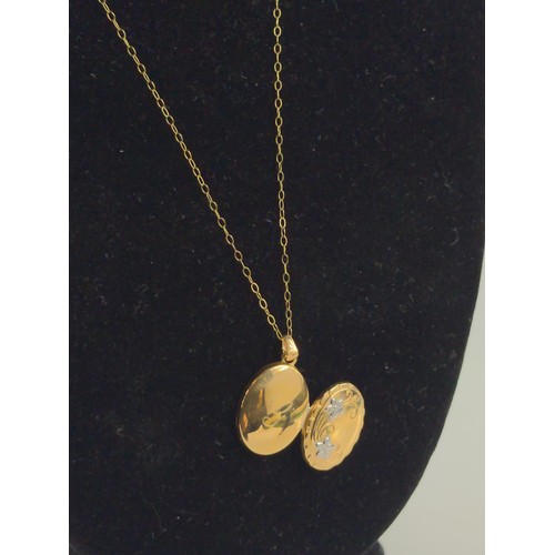 642 - 9 ct gold locket and chain. with letter G to rear . W 1.1cm