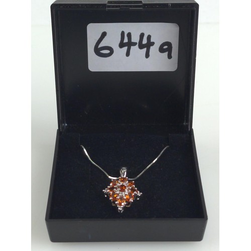 644A - 9ct white gold, orange garnet and diamonds set pendant on a 9ct white gold snake chain. Length 430mm... 