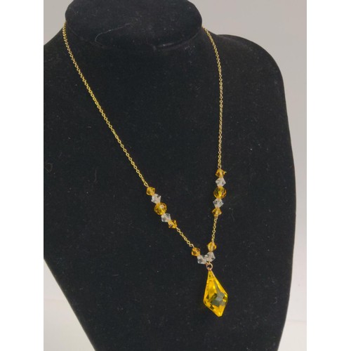 644 - 9ct gold necklace with yellow and clear faceted paste beads. Chain length 380mm. Gross weight 7.32