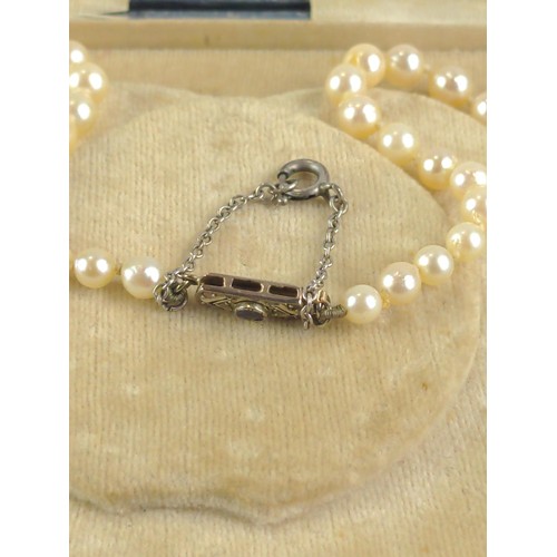 652 - String of graduated cultured pearls with a 9ct white gold clasp set with sapphire and diamond accent... 