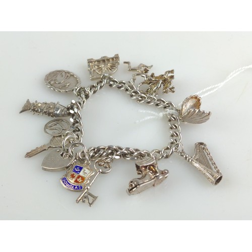 653 - Silver charm bracelet with 12 charms including a Georg Jensen St Christopher marked  GJ Lt... 