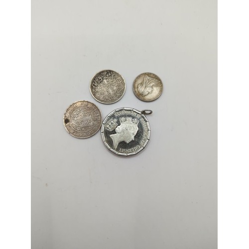 746 - Mounted Guernsey 1985 silver £2 coin together with three Victorian silver coins, gross weight ... 