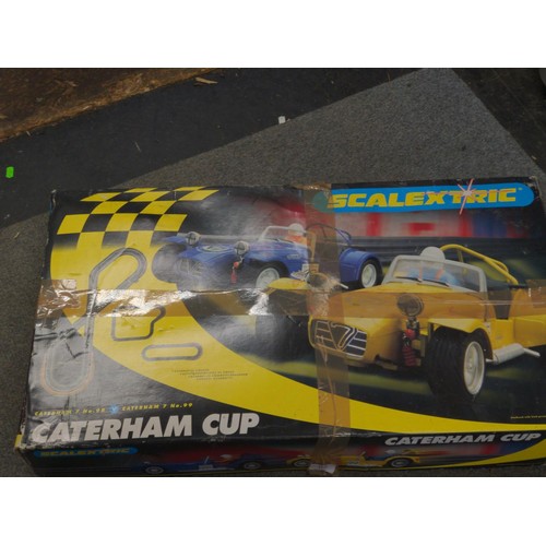 113 - Scalextric Caterham Cup complete kit, working order, includes extra 2 cars