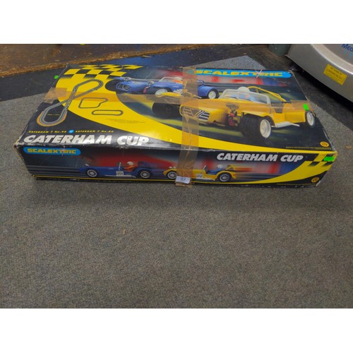 113 - Scalextric Caterham Cup complete kit, working order, includes extra 2 cars