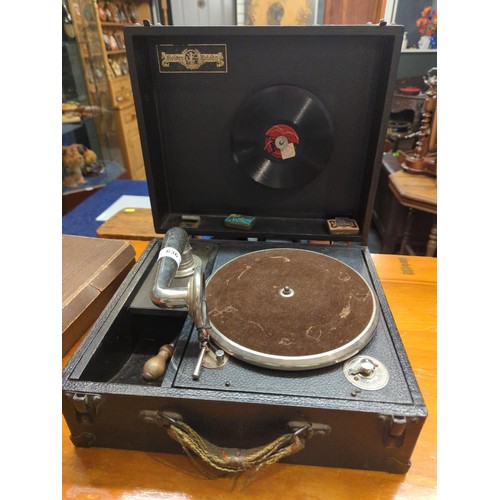 636 - Golden Melody portable gramophone with a box of vinyl and some singles. 