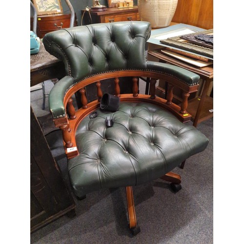 642 - Green leather button back captains chair.