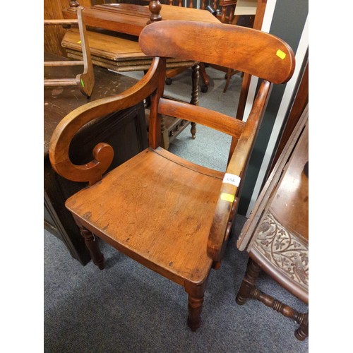 656 - Mahogany hall chair with curved arms and turned front legs. Seat 42 cm