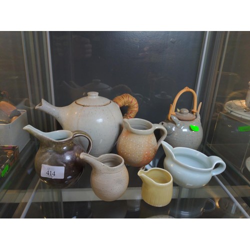 414 - Seven pieces of studio pottery, including two teapots and five jugs