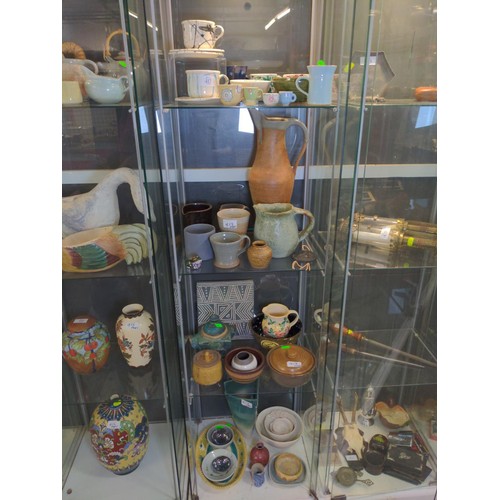 417 - Four shelves of mostly studio pottery