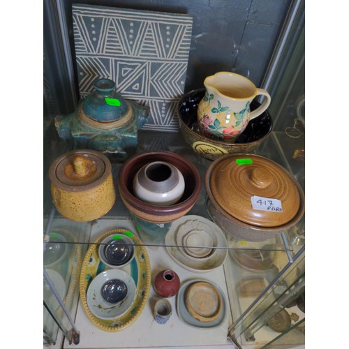 417 - Four shelves of mostly studio pottery