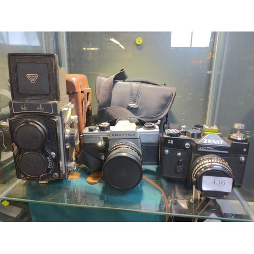 436 - Two manual SLR cameras and one TLR (120 roll film Seagull) Zenit 11, Praktica MTL 5 B plus camera ba... 