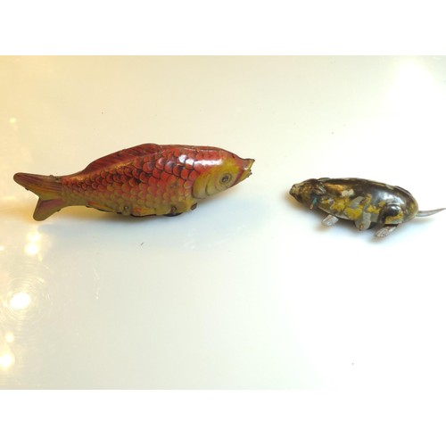 457A - Two tin penny toys. (Koi) goldfish and cat.