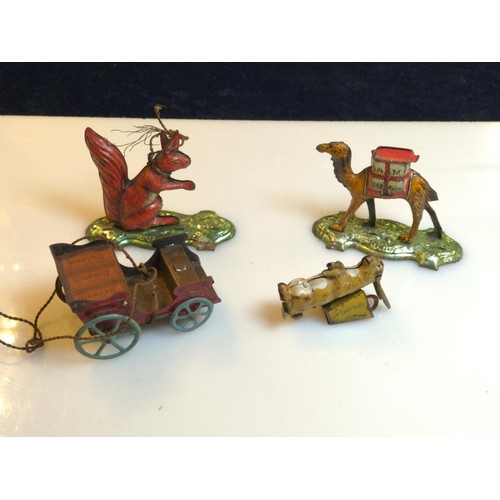 457 - Group of tin penny toys in varying conditions. Camel Squirrel, Hare and cart, may be parts missing.