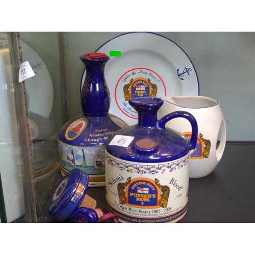 471 - Two British Navy Pussers Rum decanters, one Wade Pussers rum jug and enamel plate *no contents*