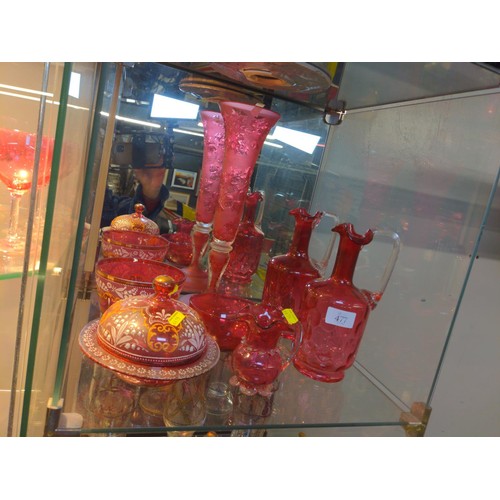 477 - Shelf of cranberry glass pieces including hand painted lily of the valley dish and dish with lid.