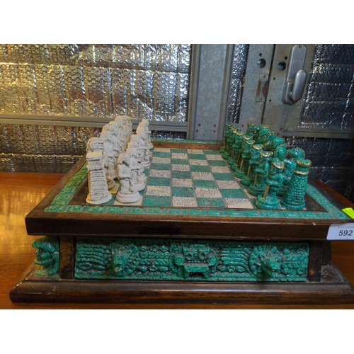 592 - Mexican chess set- Conquistadors Vs Incas. 39cm x 39 cm x H11cm.