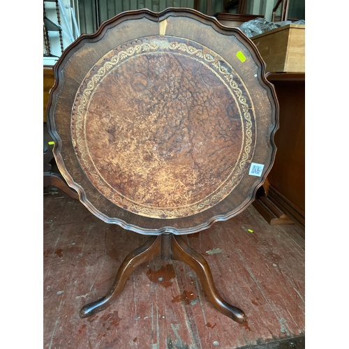 321 - Tilt top occasional table with leather top and mahogany veneer. Dia  63 H 52 cm