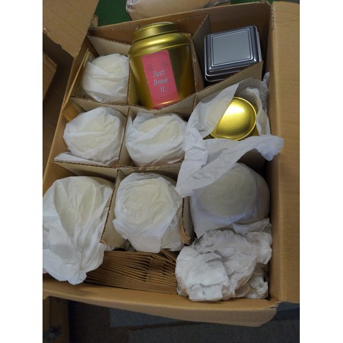 131 - Box of as new small kitchen gifts including infusers, bags of various tea, brewing timers etc.