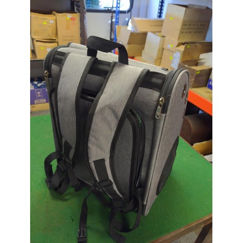 193 - small backpack pet carrier with front see through panel.