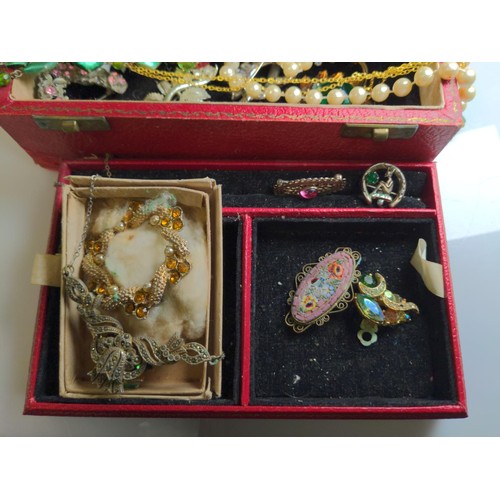 553 - Red jewellery box containing two silver brooches and various costume jewellery