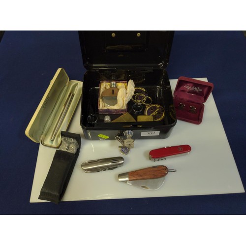 562 - Various collectables in black cash tin, including boxed Parker fountain pen, pair of HM silver cuffl... 