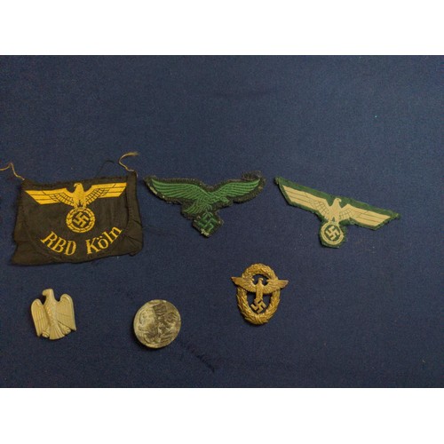 574 - German badges and pins, some WWII to include Police cap badge, eagle pin, RBD Koln railway cloth bad... 