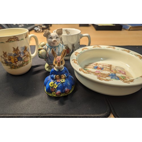 620 - Bunnykins cup and bowl, Royal Doulton Daisy Bunnykins, Beswick Little Pig Robinson (small chip to ea... 