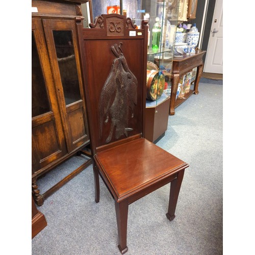 867 - Mahogany hall chair with hunting scene to back featuring hanging game with neoclassical legs. Back H... 