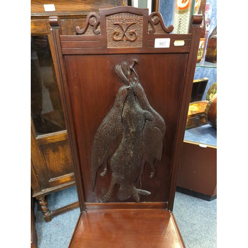 867 - Mahogany hall chair with hunting scene to back featuring hanging game with neoclassical legs. Back H... 