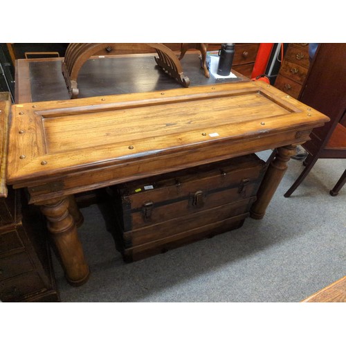 870 - Mexican pine style console table with stud detail, central deep recess and large robust legs. W136 D... 