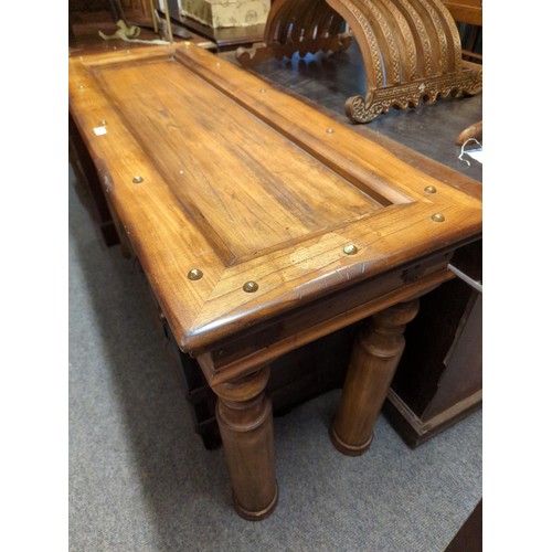 870 - Mexican pine style console table with stud detail, central deep recess and large robust legs. W136 D... 