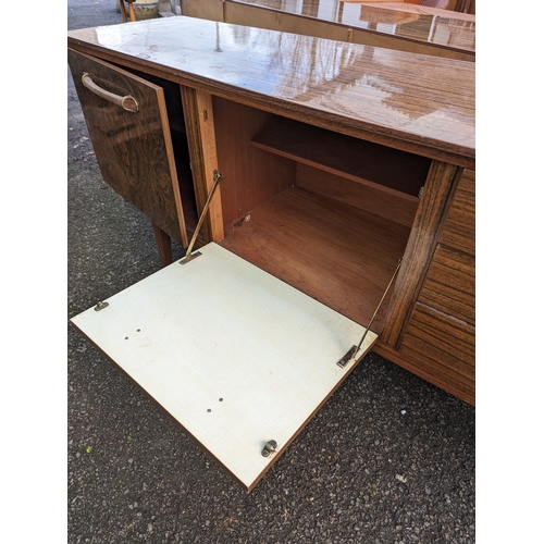 76 - Beautility walnut veneer effect sideboard, with single door, drop front and 3 drawers. W184cm D48cm ... 