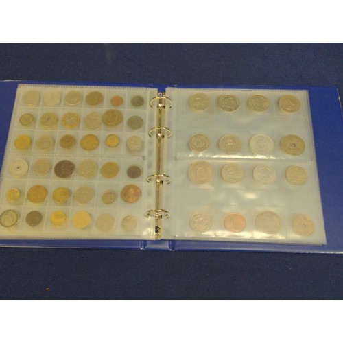 384 - Blue coin album containing mixed world coins, gross weight including album 1.53kg