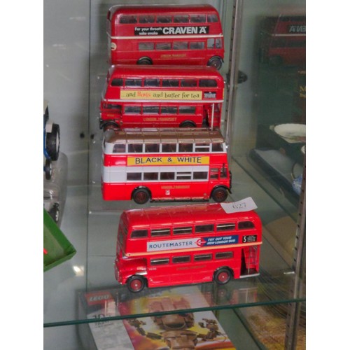 446 - Two Corgi and two Solido die-cast double decker buses.