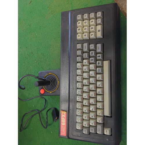 181 - LMT 68FX2 keyboard, vintage joystick, manuals & vintage Spectrum games etc.