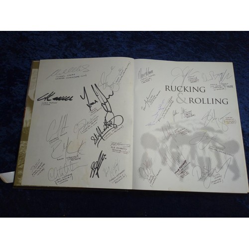 328 - Rucking and Rolling, 60 Years of International Rugby by Peter Bills, signed to both endpapers by Lei... 