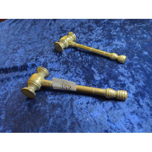 352 - Two small brass gavels Length 15 cm