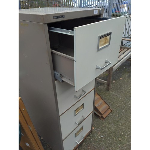 39 - 4 drawer filing cabinet by RONEO VICKERS