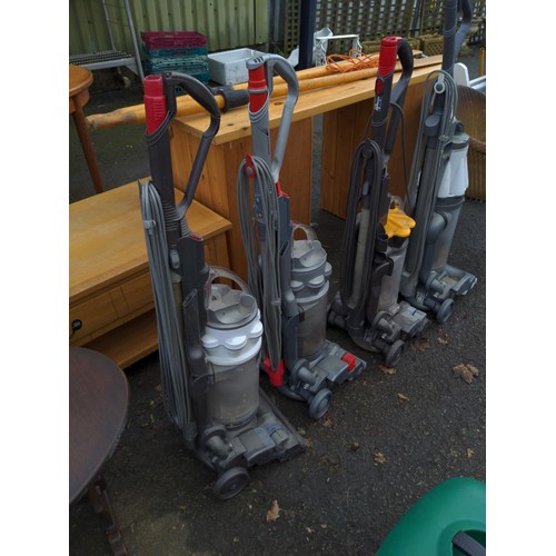 58 - Quantity of four Dyson vacuum cleaners. inc Dc7 2 x DC14 & DC33